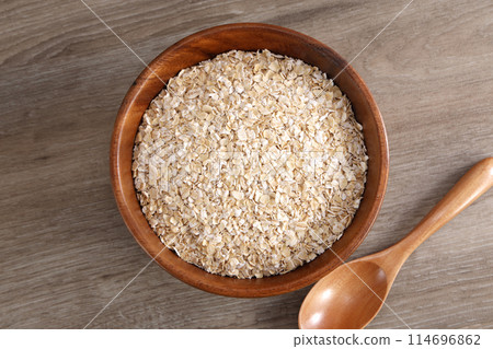Oatmeal served in a wooden bowl Oatmeal served in a wooden bowl 114696862