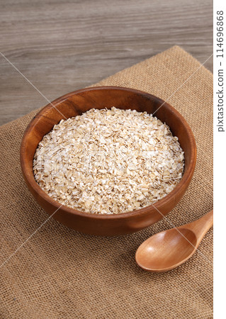 Oatmeal served in a wooden bowl 114696868