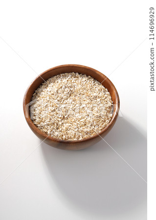Oatmeal served in a wooden bowl 114696929