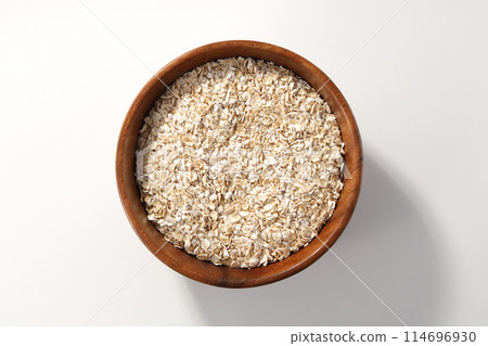 Oatmeal served in a wooden bowl Oatmeal served in a wooden bowl 114696930
