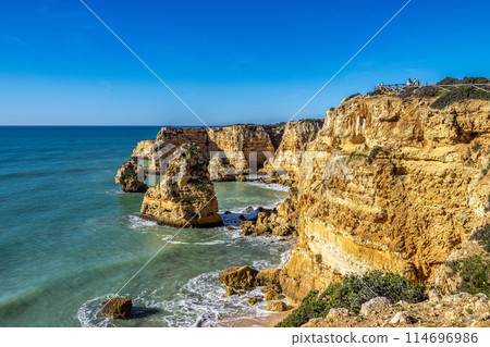 Praia da Marinha Beach among rock islets and cliffs seen from Seven Hanging Valleys Trail, Algarve, Portugal Praia da Marinha Beach among rock islets and cliffs seen from Seven Hanging Valleys Trail, Algarve, Portugal 114696986
