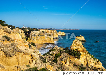 Praia da Marinha Beach among rock islets and cliffs seen from Seven Hanging Valleys Trail, Algarve, Portugal Praia da Marinha Beach among rock islets and cliffs seen from Seven Hanging Valleys Trail, Algarve, Portugal 114696994