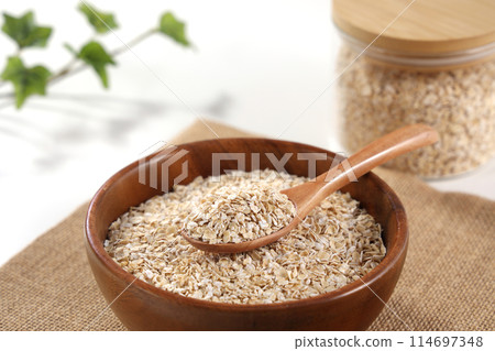 Oatmeal served in a wooden bowl Oatmeal served in a wooden bowl 114697348