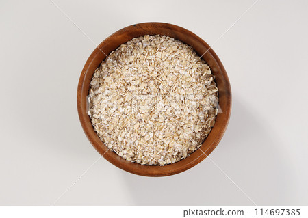 Oatmeal served in a wooden bowl Oatmeal served in a wooden bowl 114697385