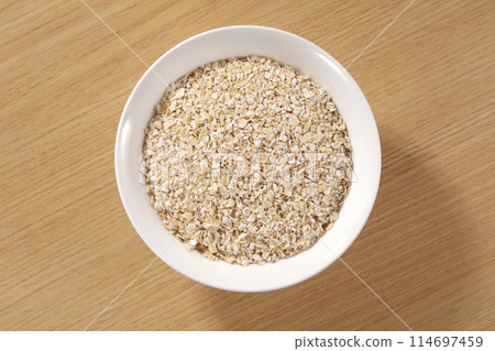 Oatmeal served on a plate 114697459