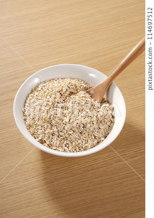 Oatmeal served on a plate 114697512