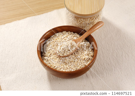 Oatmeal served in a wooden bowl 114697521