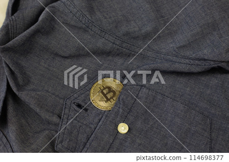 Physical version of Bitcoin in shirt pocket, cryptocurrency gold coin with money, investing and finance in cryptocurrency Physical version of Bitcoin in shirt pocket, cryptocurrency gold coin with money, investing and finance in cryptocurrency 114698377