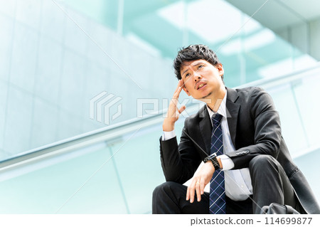 A male businessman thinking 114699877