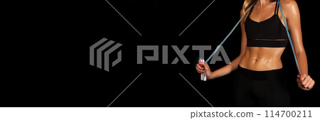 Unrecognizable Lady Holding Jump Rope On Black Studio Background. Fitness Lifestyle Concept. Free Space, Cropped 114700211