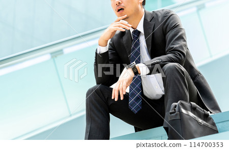 A male businessman thinking 114700353