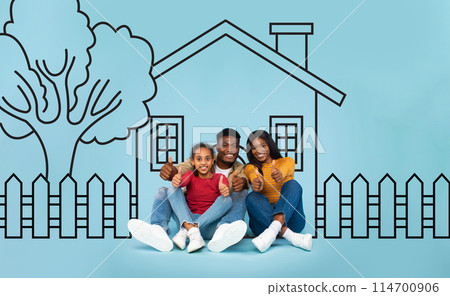 Positive black family seated on the ground in front of a house. They appear engaged in conversation or a communal activity, creating a sense of community and togetherness. Positive black family seated on the ground in front of a house. They appear engaged in conversation or a communal activity, creating a sense of community and togetherness. 114700906