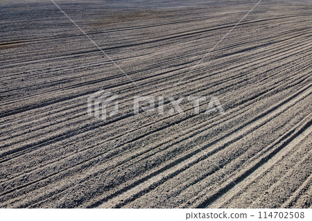 Plowed agricultural field, aerial view. Agricultural land. 114702508