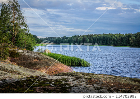 The landscape of Karelia. View of a small stone island surrounded by water. Gulf of Finland, Leningrad region 114702992