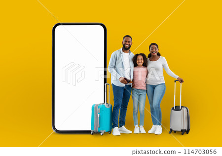 Happy family with luggage beside a large smartphone display conveying the idea of digital travel application technology, isolated on a yellow backdrop Happy family with luggage beside a large smartphone display conveying the idea of digital travel application technology, isolated on a yellow backdrop 114703056