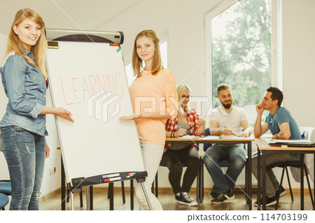 Student girl writting Learning word on whiteboard 114703199