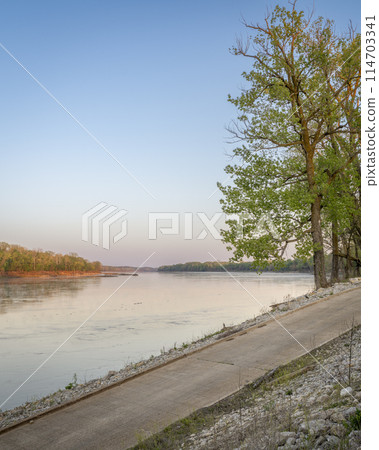 calm spring sunrise over Missouri River at Dalton Bottoms boat ramp 114703341