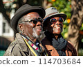 Two elderly individuals sharing a sunny moment together 114703684