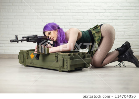 hot girl in a short sexy military skirt with a Kalashnikov assault rifle and a gun case on a brick wall background copy paste hot girl in a short sexy military skirt with a Kalashnikov assault rifle and a gun case on a brick wall background copy paste 114704050