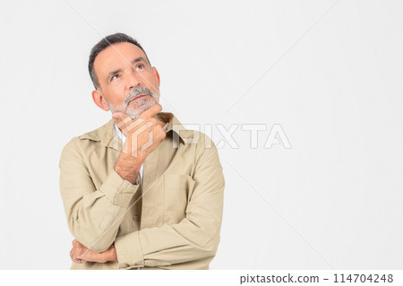 This image shows a contemplative elderly man isolated on white, arms crossed, possibly pondering life decisions or memories, copy space This image shows a contemplative elderly man isolated on white, arms crossed, possibly pondering life decisions or memories, copy space 114704248
