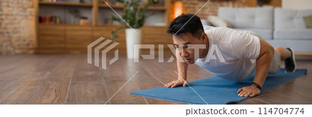 Strong asian mature man making strength workout, doing push ups on sports mat, having domestic workout. Sporty korean male training his body, leading active lifestyle, panorama with copy space 114704774