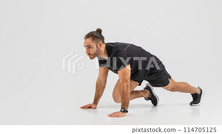 Side view of a fit guy demonstrating proper lunge technique on a clean background, focusing on leg muscles Side view of a fit guy demonstrating proper lunge technique on a clean background, focusing on leg muscles 114705125