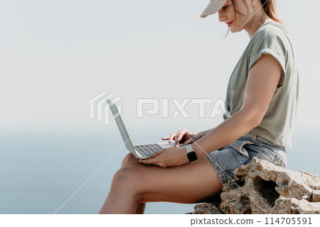 Woman sea laptop. Business woman, freelancer with laptop working over blue sea beach. Happy smiling girl relieves stress from work. Freelance, remote work on vacation, digital nomad, travel concept Woman sea laptop. Business woman, freelancer with laptop working over blue sea beach. Happy smiling girl relieves stress from work. Freelance, remote work on vacation, digital nomad, travel concept 114705591