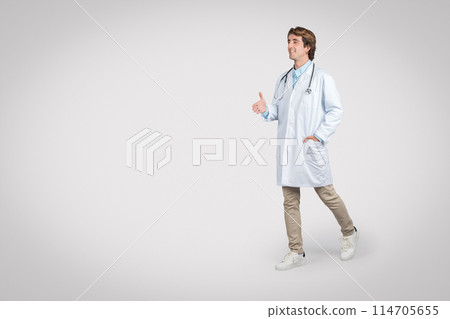 Cheerful male doctor strides forward, wearing white lab coat and stethoscope, gesturing conversationally with his hand out, evoking sense of approachability and friendliness Cheerful male doctor strides forward, wearing white lab coat and stethoscope, gesturing conversationally with his hand out, evoking sense of approachability and friendliness 114705655