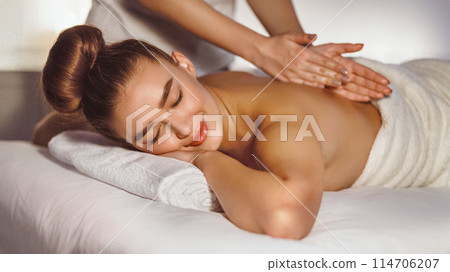 Body Care. Woman Enjoying Back Massage, Having Rest In Spa Centre Body Care. Woman Enjoying Back Massage, Having Rest In Spa Centre 114706207