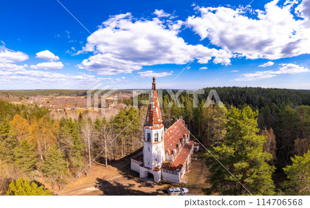 Aerial top view to Finnish Lutheran Church in Lumivaara village. Building in Neo-Gothic style in summer sunny day. Attractions of Lahdenpokh district. Designed architect Adolf Ilmari. Karelia Russia 114706568