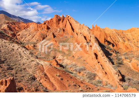 landscape of Skazka canyon on Issyk-Kul lake. Rocks Fairy Tale famous destination in Kyrgyzstan. Mountain like great wall of china and Rainbow Mountains of Danxia or Antelope crevice USA, Central Asia 114706579