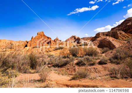 landscape of Skazka canyon on Issyk-Kul lake. Rocks Fairy Tale famous destination in Kyrgyzstan. Mountain like great wall of china and Rainbow Mountains of Danxia or Antelope crevice USA, Central Asia 114706598