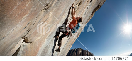 Climber Scaling a Steep Cliff 114706775