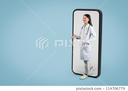 Young nurse in uniform emerges from oversized smartphone screen to greet, symbolizing the personal touch in modern telehealth services, against blue background, free space 114706779