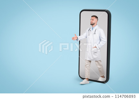 Young European male doctor emerging from cellphone screen, extending his hand in welcoming handshake gesture against blue background, free space Young European male doctor emerging from cellphone screen, extending his hand in welcoming handshake gesture against blue background, free space 114706893
