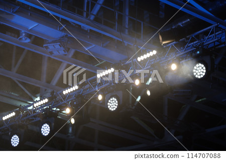 Stage lighting equipment indoor stage. Entertainment concert lighting. Led lighting devices under roof. download 114707088