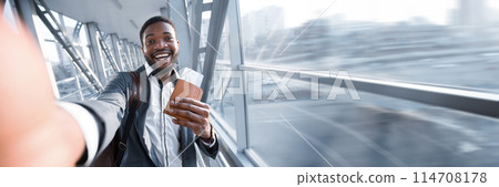 Happy African American Businessman Taking Selfie In Airport, Holding Passport With Tickets, Panorama With Copy Space 114708178