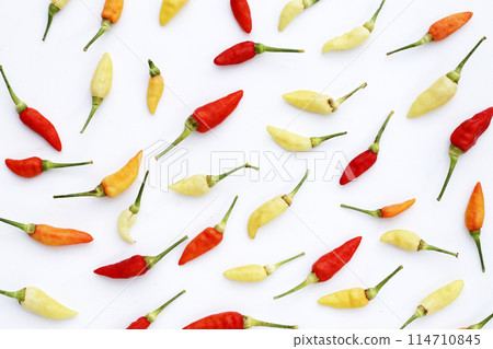 Fresh chili peppers on white background Fresh chili peppers on white background 114710845