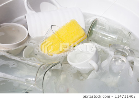Washing used drinking glasses and cups Washing used drinking glasses and cups 114711402