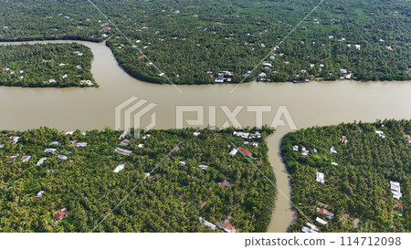 Amazing aerial view of Mekong Delta, vast coconut, palm, nipa tree field, irrigation system by canal with many river branch, water source for agriculture and waterway transport with cheap Amazing aerial view of Mekong Delta, vast coconut, palm, nipa tree field, irrigation system by canal with many river branch, water source for agriculture and waterway transport with cheap 114712098