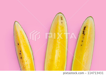 Yellow watermelon slices on white background. Yellow watermelon slices on white background. 114713431