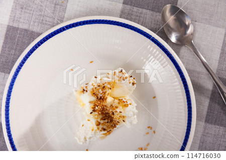 Homemade hearty breakfast - cottage cheese with honey sauce. dish is richly decorated with sesame Homemade hearty breakfast - cottage cheese with honey sauce. dish is richly decorated with sesame 114716030