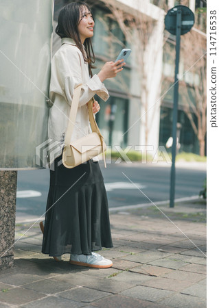 Full-length shot of a young woman who was the first to arrive at the meeting place 114716538