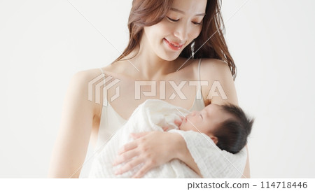 A mother holding a one month old baby 114718446