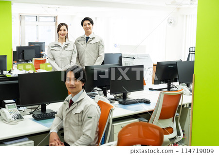 Engineers working in a sleek office 114719009