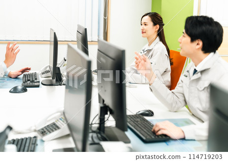 Engineers in work clothes working in a research lab Engineers in work clothes working in a research lab 114719203