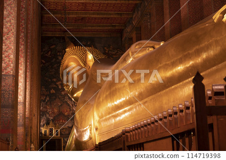 The giant reclining Buddha golden statue is seen at Wat Pho temple complex The giant reclining Buddha golden statue is seen at Wat Pho temple complex 114719398