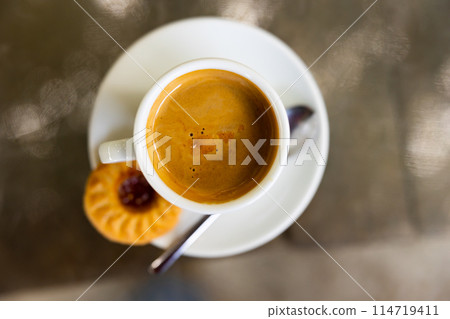 Cup of cortado, Spanish beverage made of espresso with dessert 114719411