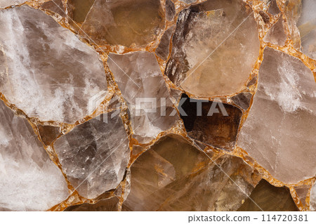 Brown smoky quartz stone slab, precious mineral. Gemstone background. Brown smoky quartz stone slab, precious mineral. Gemstone background. 114720381