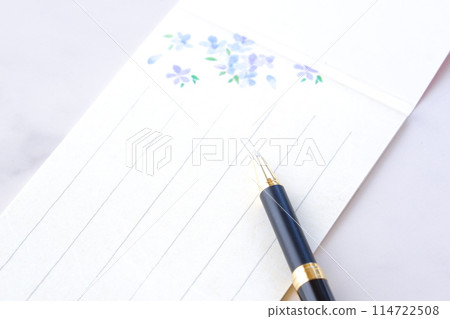 Write a letter on a notepad Write a letter on a notepad 114722508
